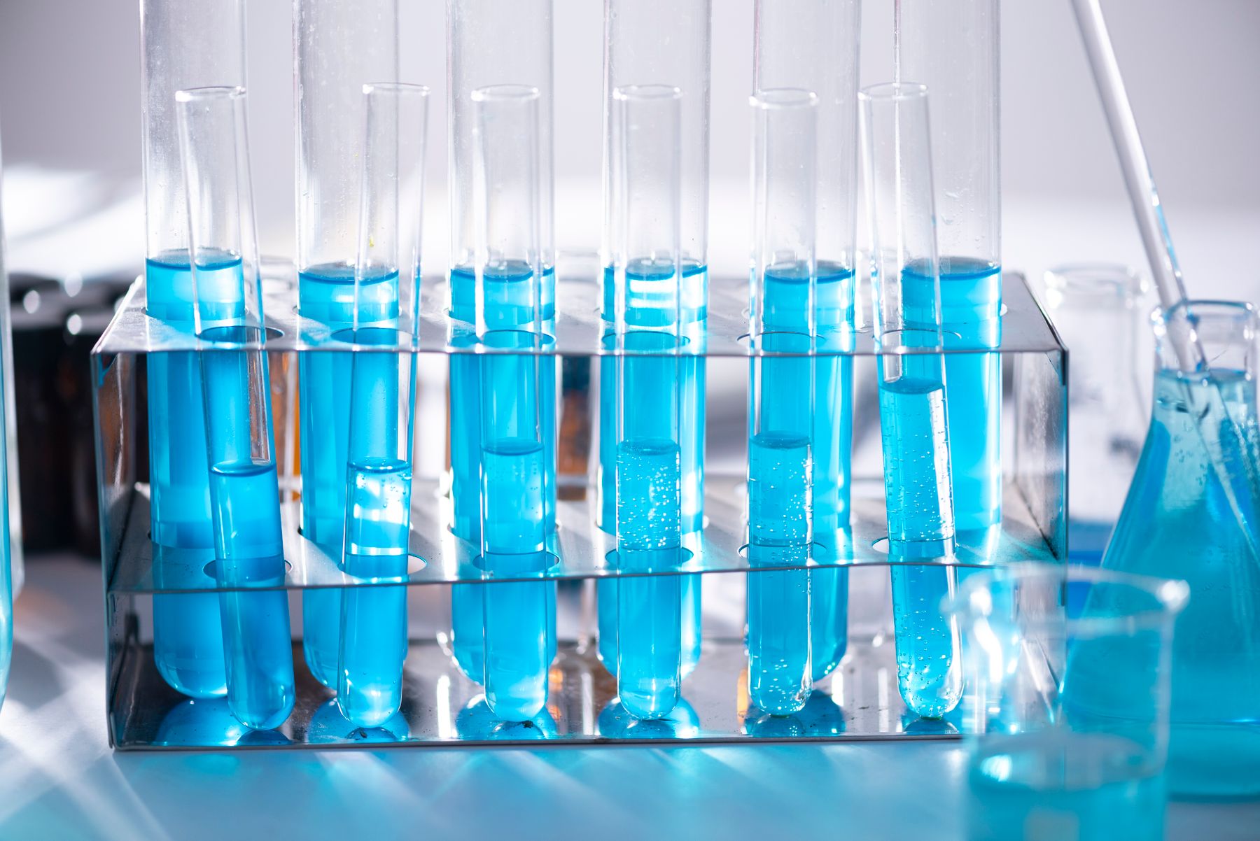 A rack of blue test tubes